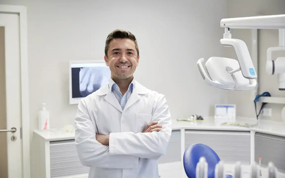 Happy Orthodontist in a Dental Clinic