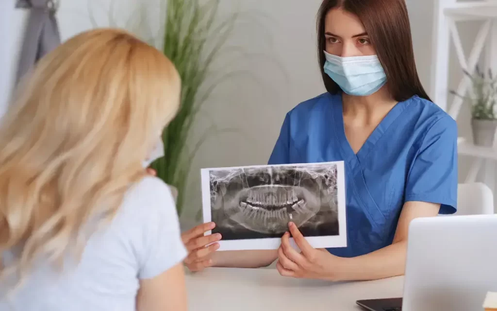 Woman Orthodontist Explaining a Procedure to a Patient